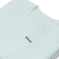 Bull Wrestling heather prism ice blue tee — front Pistolero Clásico logo — Pistolero Clásico